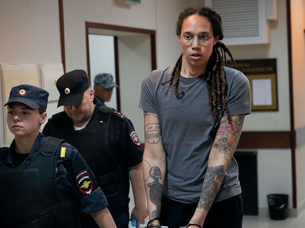 PHOTO: FILE - WNBA star and two-time Olympic gold medalist Brittney Griner is escorted from a courtroom after a hearing in Khimki just outside Moscow, Russia, on Aug. 4, 2022. 