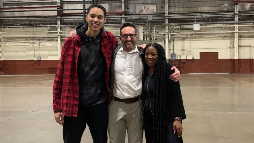 PHOTO: Basketball player Brittney Griner stands with U.S. Special Presidential Envoy for Hostage Affairs Roger Carstens and her wife Cherelle after arriving in the U.S. following her release by Russia.