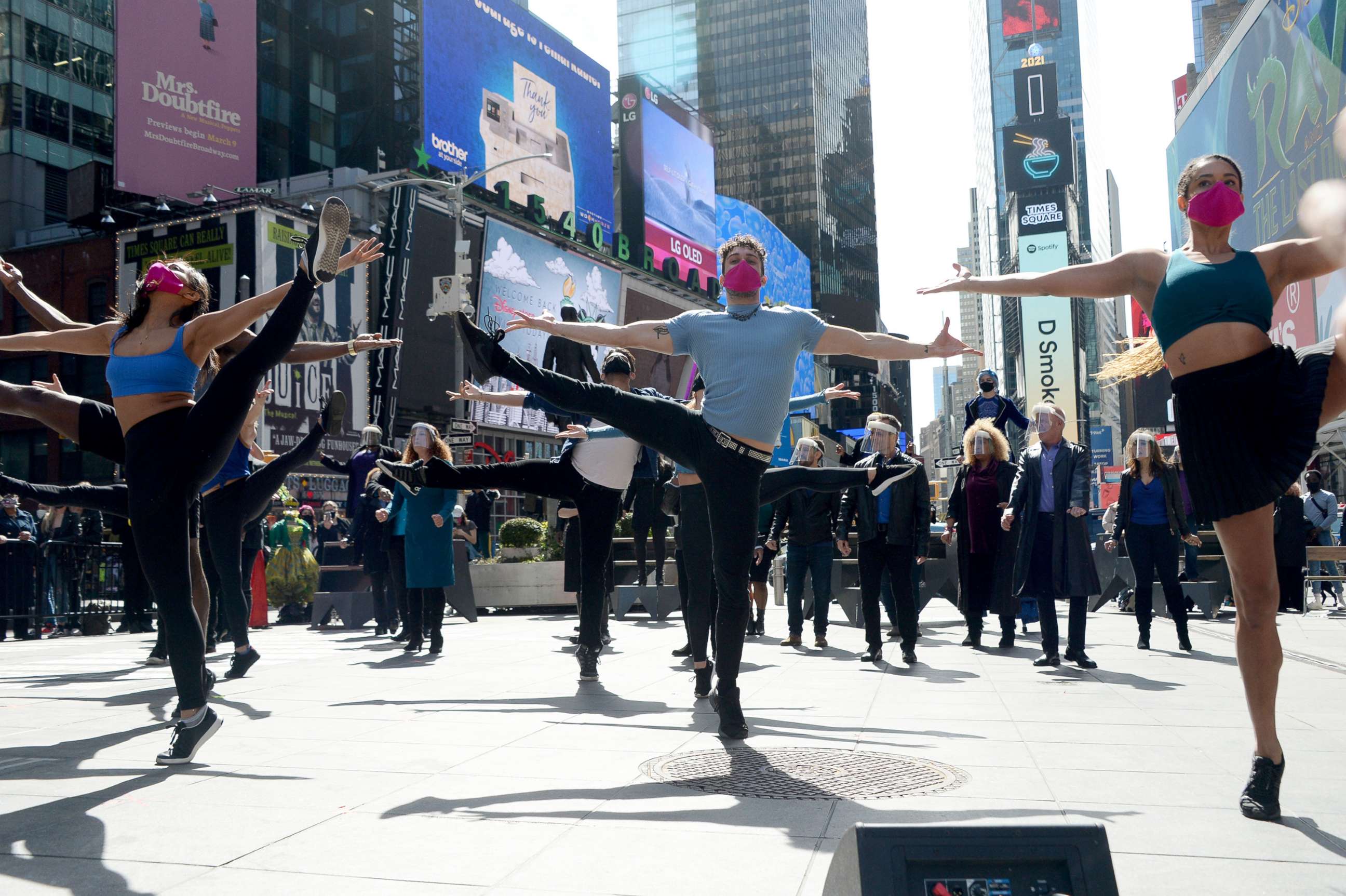 PHOTO: Performers dance during the "We Will Be Back" Broadway Celebration in Times Square, March 12, 2021, in New York City.