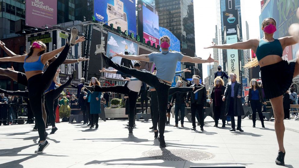 PHOTO: Performers dance during the "We Will Be Back" Broadway Celebration in Times Square, March 12, 2021, in New York City.