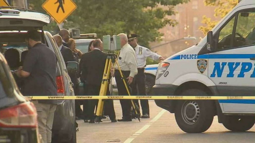 Police investigate where two bags of human remains were found on the side of the street just south of Crotona Park in the Bronx, New York, on Friday, Aug. 24, 2018.