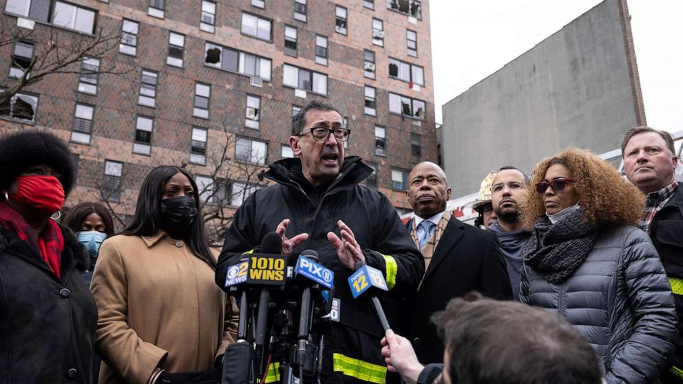 PHOTO: FDNY commissioner Daniel A. Nigro, middle, speaks during a a news conference outside an apartment building where a deadly fire occurred in the Bronx on Sunday, Jan. 9, 2022, in New York. 