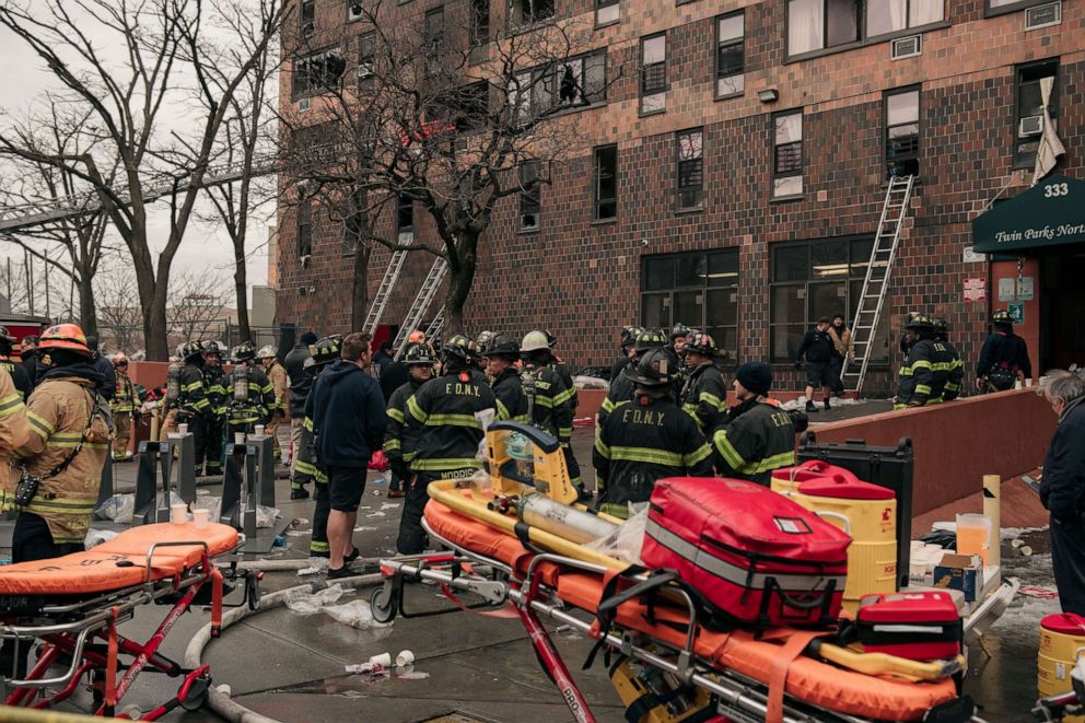 PHOTO: Emergency first responders remain at the scene of an intense fire at a 19-story residential building that erupted in the morning on Jan. 9, 2022 in the Bronx borough of New York City. 