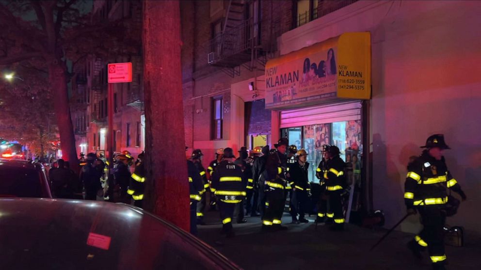 PHOTO: First responders gather at the scene of a floor collapse at New Klaman Hair Braiding store in the Bronx borough of New York, Dec. 5, 2021.