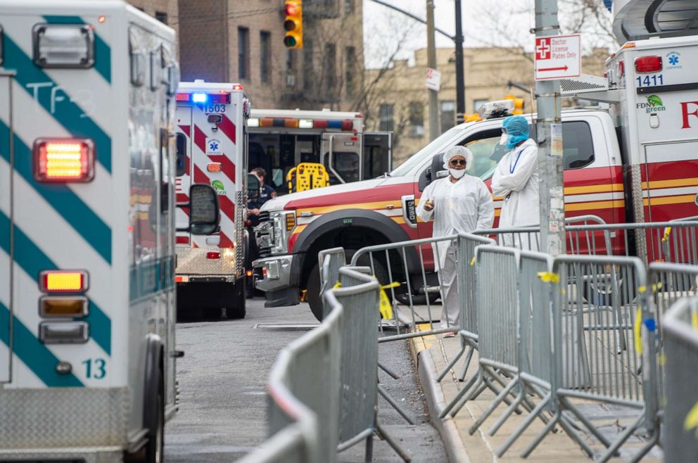 PHOTO: Bronx-Lebanon Hospital Center medical staff stand outside of the emergency room bay, April 9, 2020, in the Bronx borough of New York.