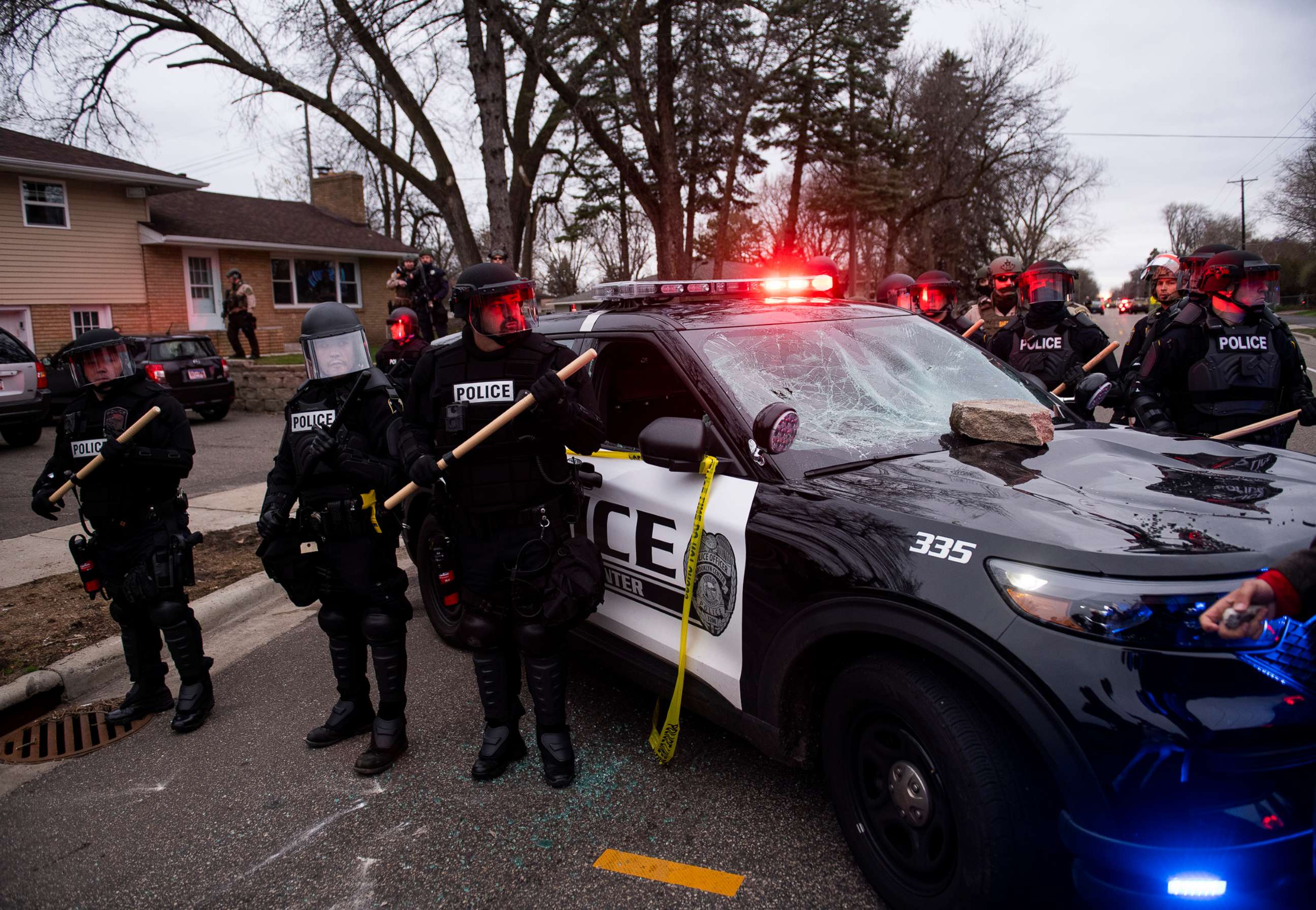 PHOTO: Law enforcement surrounds a smashed police cruiser on April 11, 2021, in Brooklyn Center, Minn.