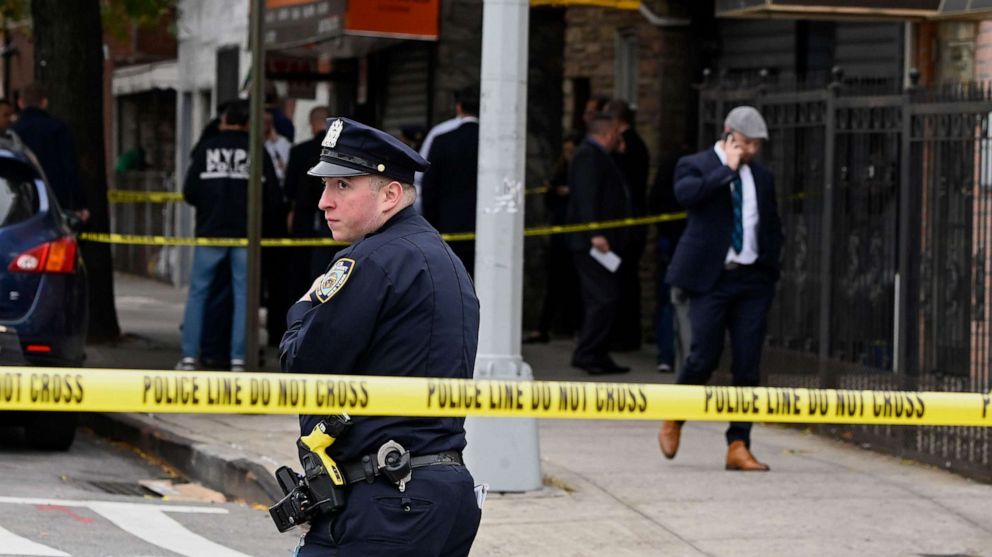 PHOTO: New York police officers secure a crime scene outside a club after a shooting in Brooklyn on Oct. 12, 2019.