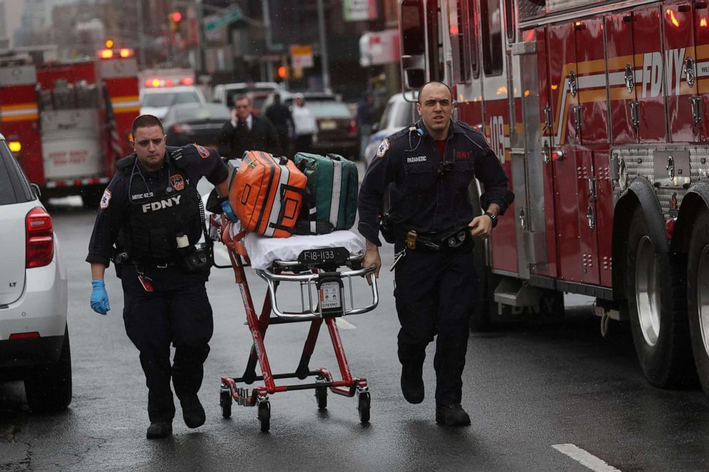 PHOTO: Emergency personnel work near the scene of a shooting at a subway station in the Brooklyn borough of New York City, April 12, 2022.