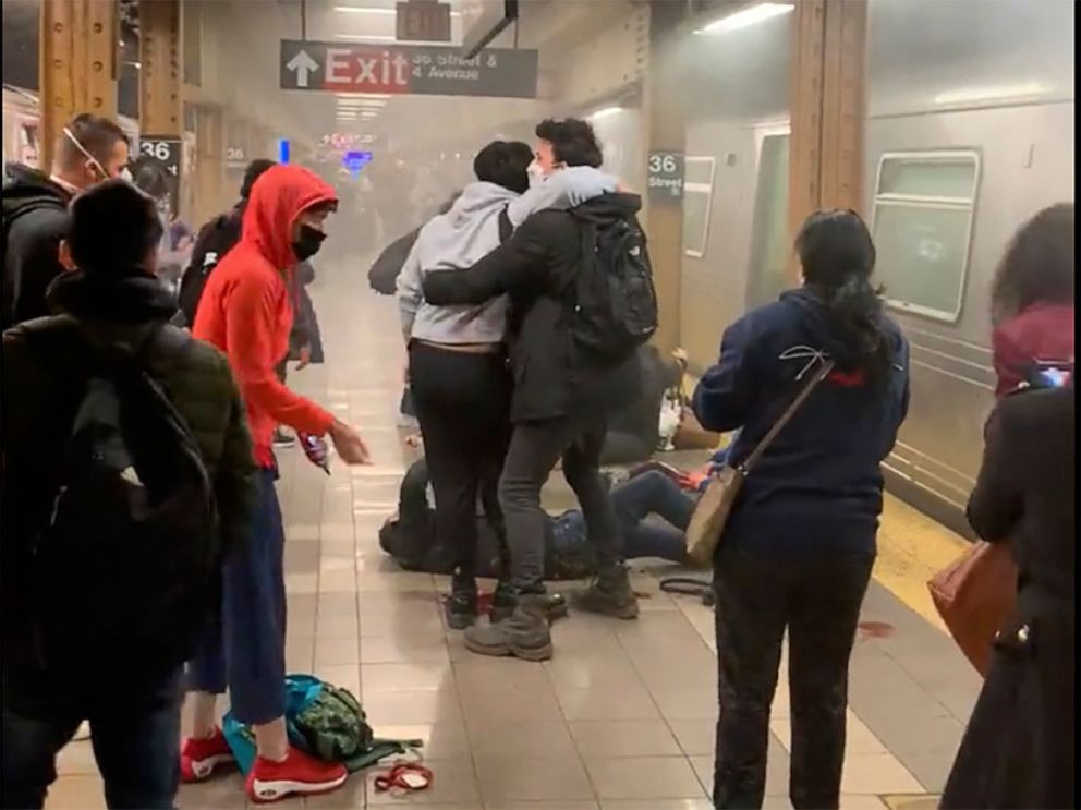 PHOTO: A person receives aid in the aftermath of a shooting in a subway car in the Brooklyn borough of New York City, April 12, 2022.