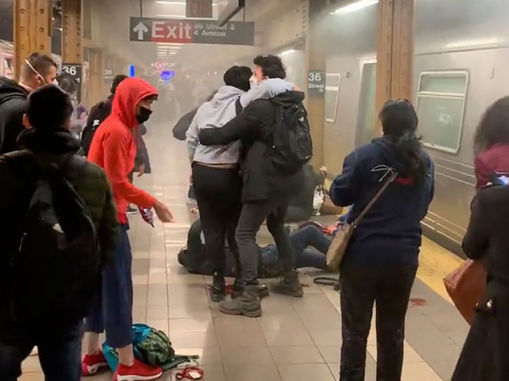 PHOTO: This photo provided by Will B Wylde, a person is aided outside a subway car in the Brooklyn borough of New York, April 12, 2022.