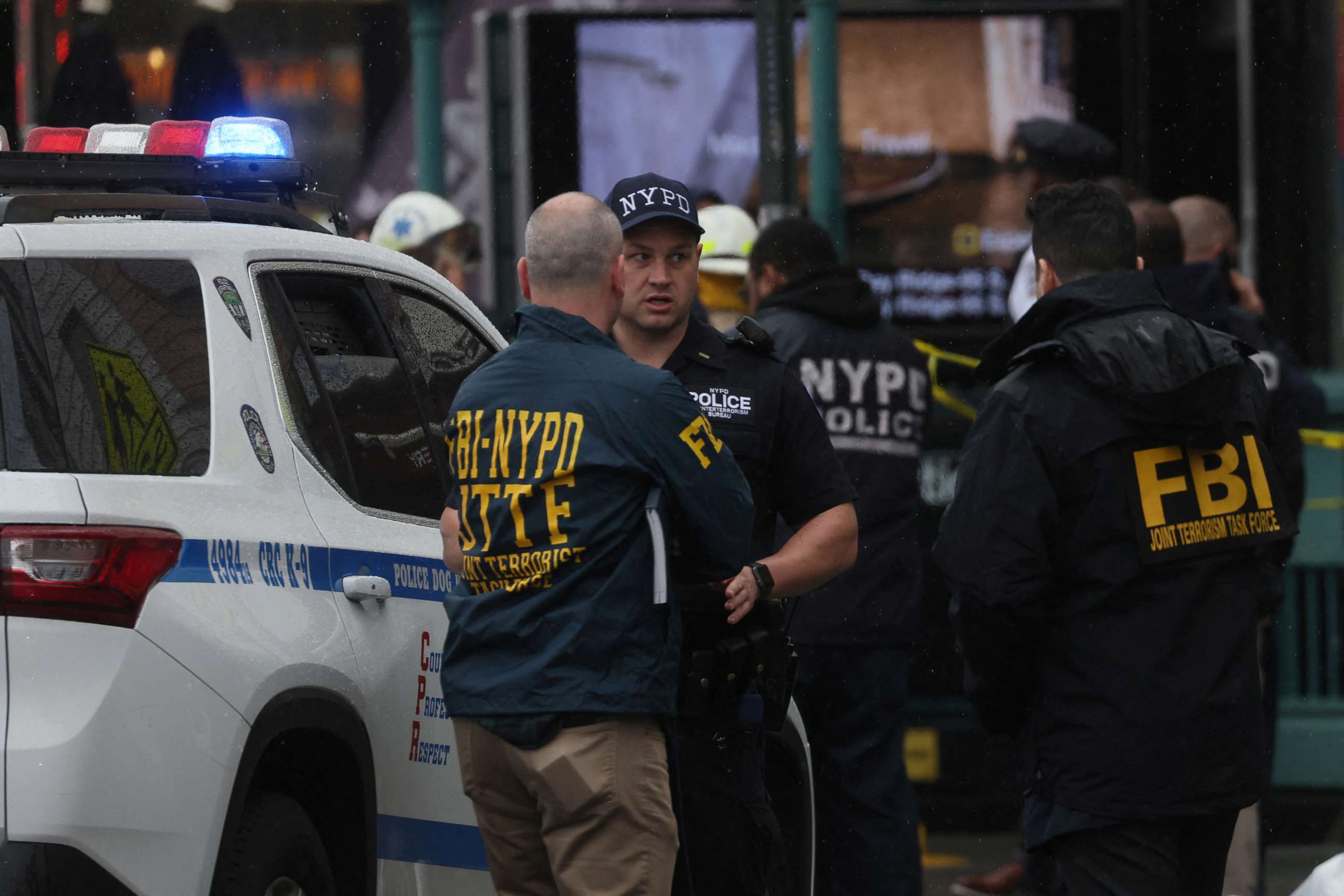 PHOTO: Law enforcement officers work near the scene of a shooting at a subway station in the Brooklyn borough of New York City, April 12, 2022.