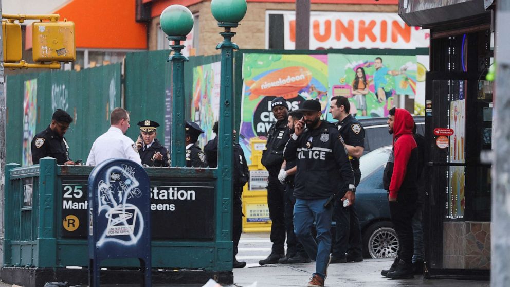 PHOTO: Police officers work at the scene of a shooting at a subway station in the Brooklyn borough of New York City, April 12, 2022.