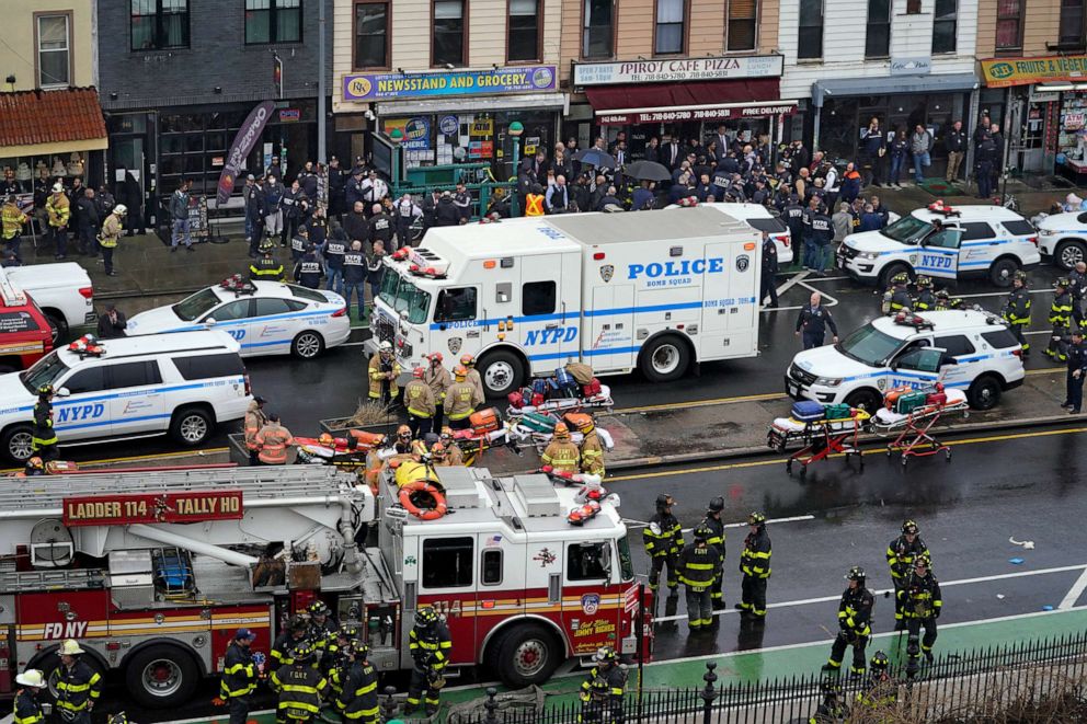 PHOTO: Emergency personnel gather at the entrance to a subway stop in the Brooklyn borough of New York, April 12, 2022.