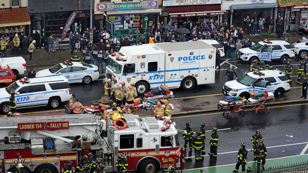 PHOTO: Emergency personnel gather at the entrance to a subway stop in the Brooklyn borough of New York, April 12, 2022.
