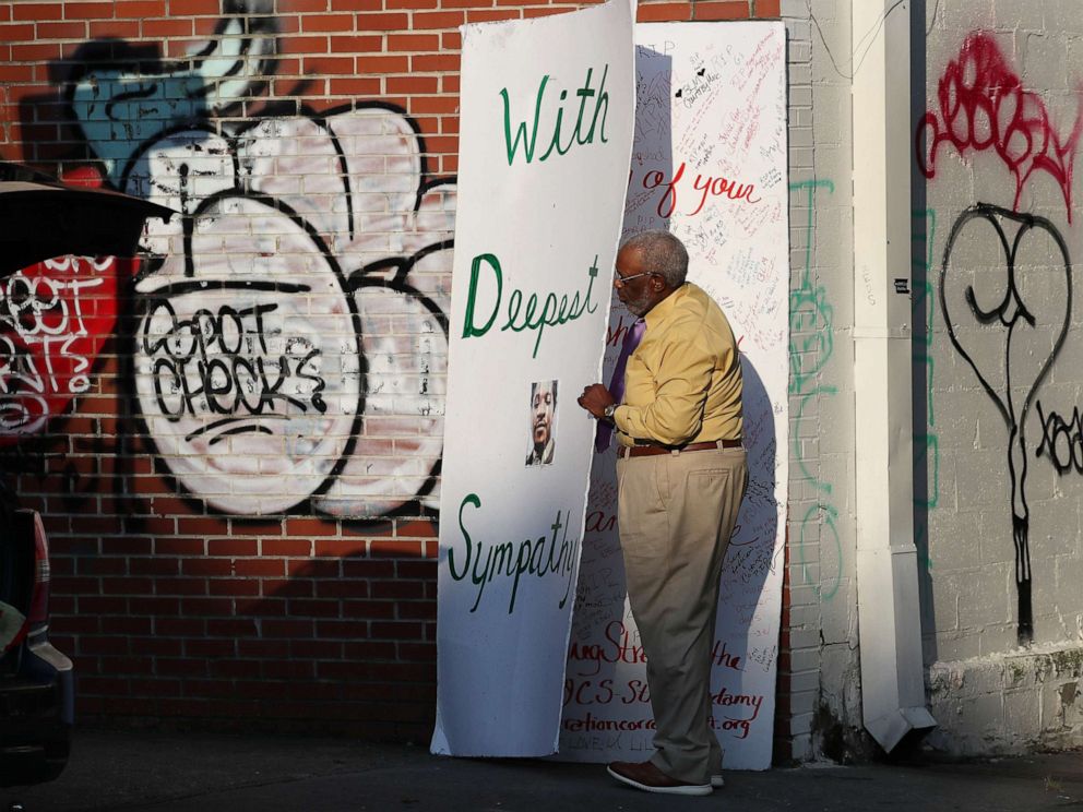 PHOTO: Bruce W. Griggs places a sympathy card near the Ebenezer Baptist Church where the viewing for Rayshard Brooks is being held on June 22, 2020 in Atlanta.