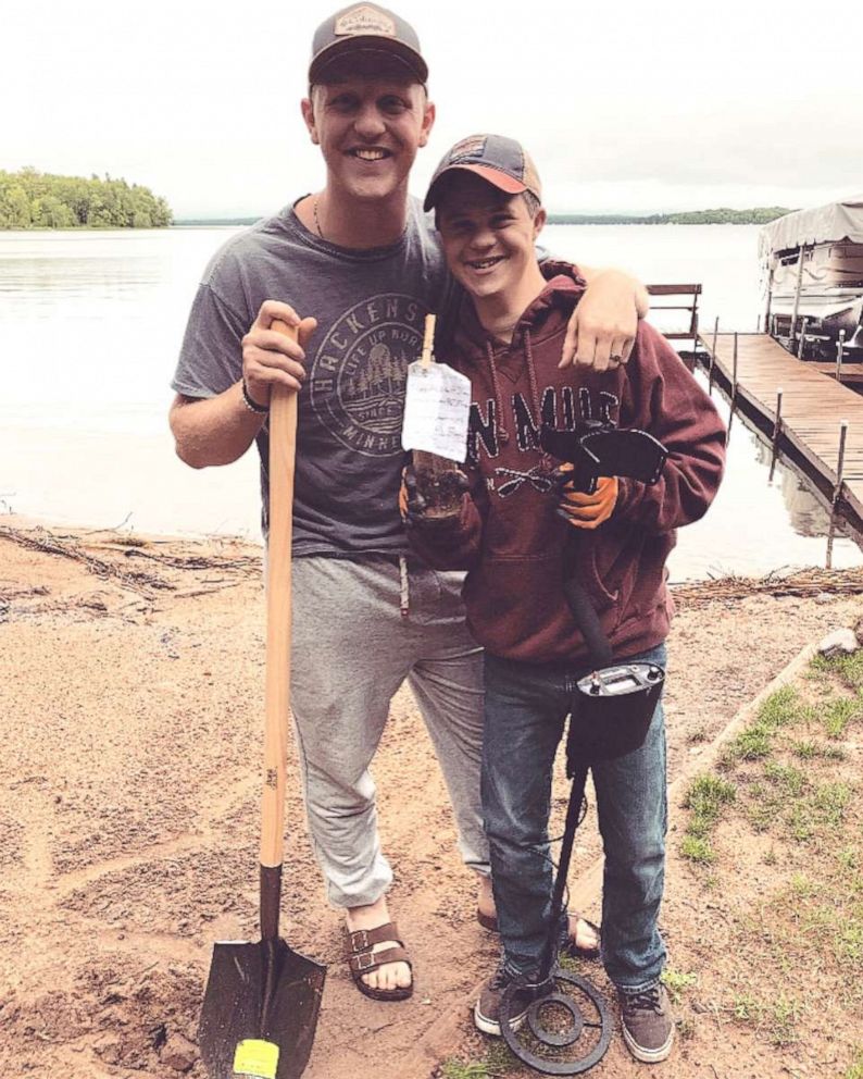 PHOTO: Henry and Will Claussen pictured with the message in the bottle that asked Henry to be Will's best man at his wedding in Mankato, Minn.