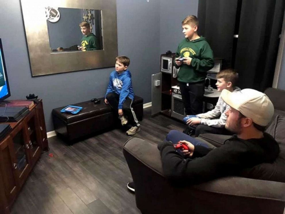 PHOTO: Brothers Tyson, Talon and Skyler, play video games with NFL quarterback Matthew Stafford. Talon told ABC News he'd never forget losing to Stafford in "Madden."