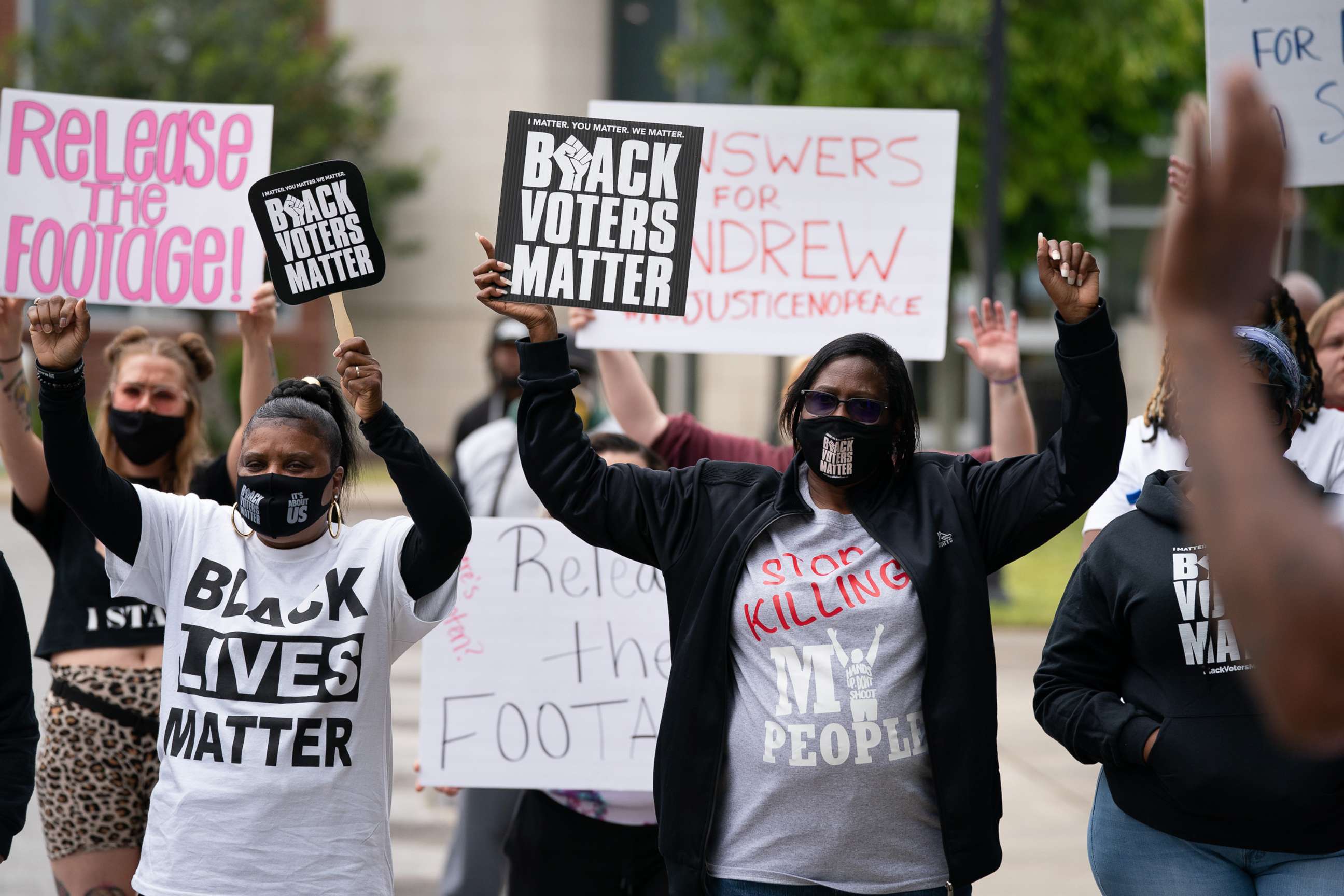 PHOTO: Demonstrators hold signs during a protest march, April 24, 2021, in Elizabeth City, N.C., calling for the release of body camera footage from the shooting death of Andrew Brown Jr., 3 days prior.
