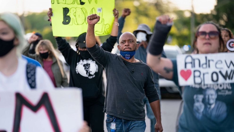 PHOTO: Protestors march in the street after a news conference addressing police video footage of the shooting death of Andrew Brown Jr., May 11, 2021, in Elizabeth City, N.C.