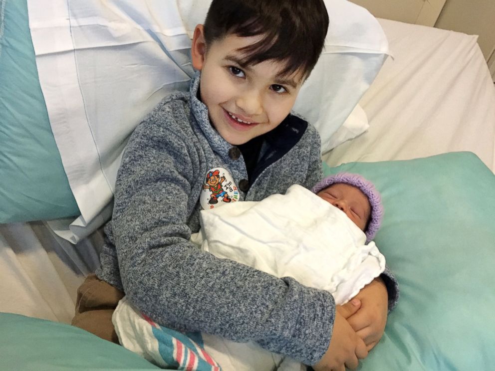 PHOTO: Mason Brunk, 7, holds his newborn sister Layla at West Allis Memorial Hospital in West Allis, Wis., Nov. 27, 2018.