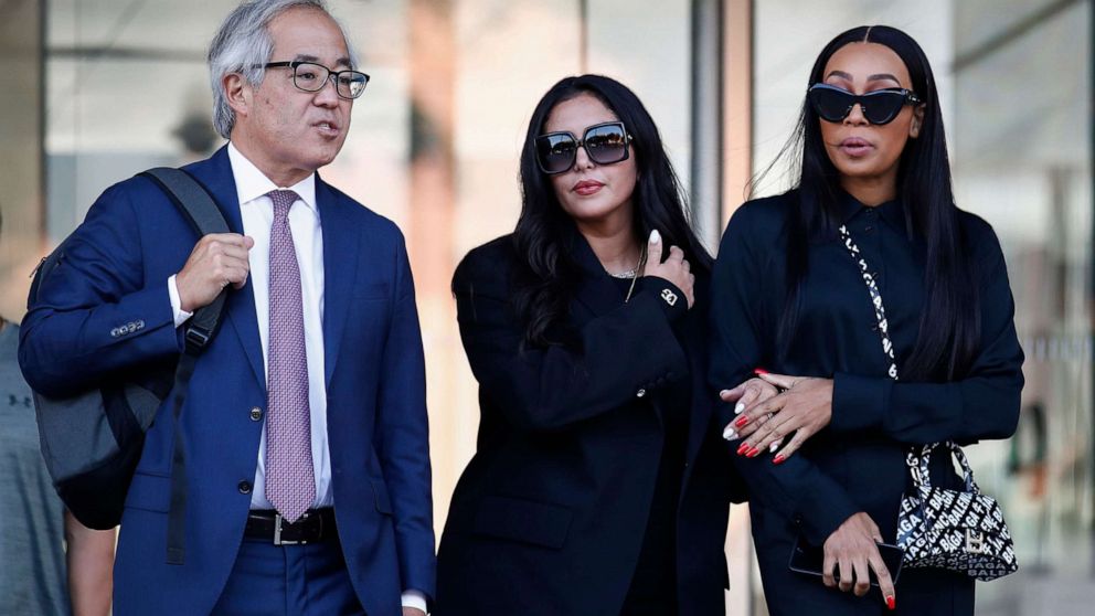 PHOTO: Vanessa Bryant (C), the widow of the late Kobe Bryant, flanked by her trial lawyer, Luis Li (L), and friend, Sydney Leroux (R), leaves a federal courthouse in Los Angeles, Aug. 23, 2022. 