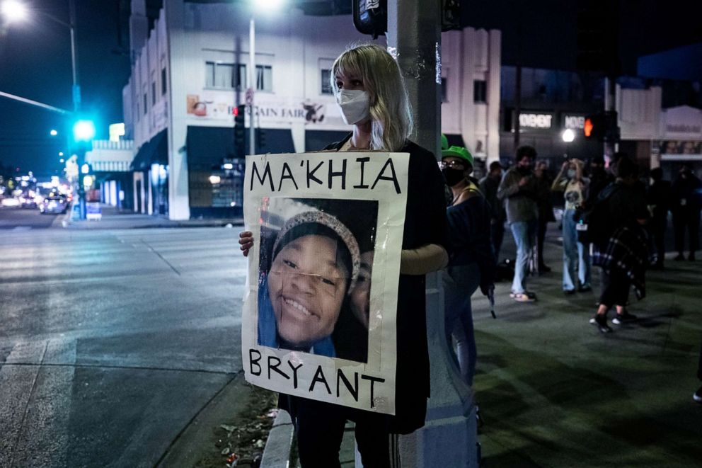 PHOTO: A protester holds a poster displaying the portrait of Ma'Khia Bryant, shot by police in Columbus, Ohio, as people gathered after the guilty verdict in the trial of former Minneapolis police officer Derek Chauvin, April 20, 2021, in Los Angeles.