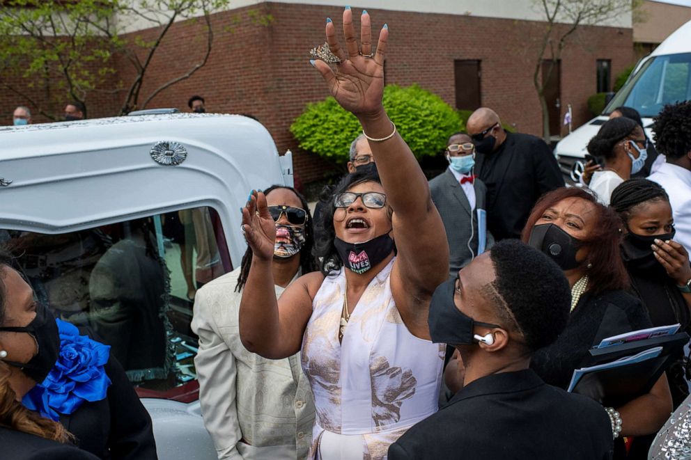 PHOTO: Paula Bryant, center, releases a butterfly in honor of her daughter, Ma'Khia Bryant, following the funeral for 16-year-old at the First Church of God in Columbus, Ohio, April 30, 2021.