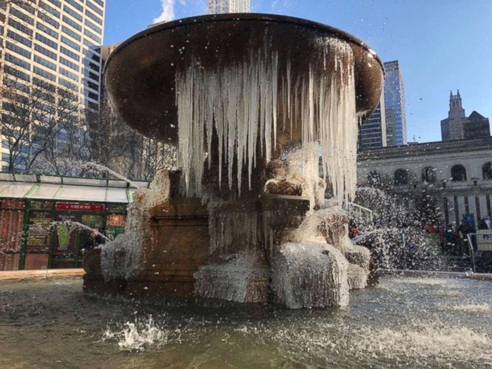 PHOTO: A frozen fountain during cold winter weather in Bryant Park, Dec. 27, 2017, in New York City.