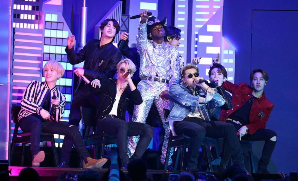 PHOTO: Lil Nas X, background center, and members of BTS perform "Old Town Road" at the 62nd annual Grammy Awards on Sunday, Jan. 26, 2020, in Los Angeles.