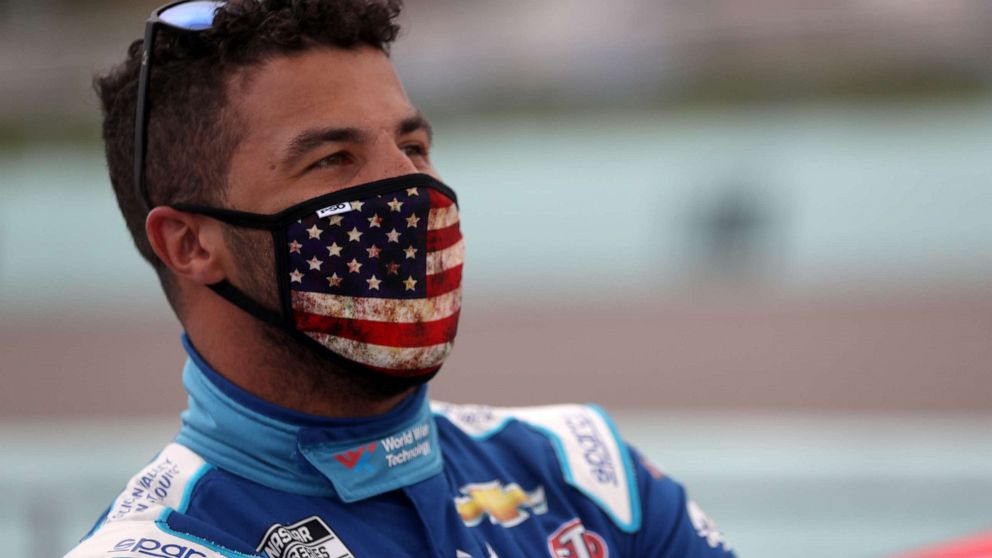 PHOTO: Bubba Wallace, driver of the #43 World Wide Technology Chevrolet, stands on the grid prior to the NASCAR Cup Series Dixie Vodka 400 at Homestead-Miami Speedway on June 14, 2020 in Homestead, Florida. (Photo by Chris Graythen/Getty Images)