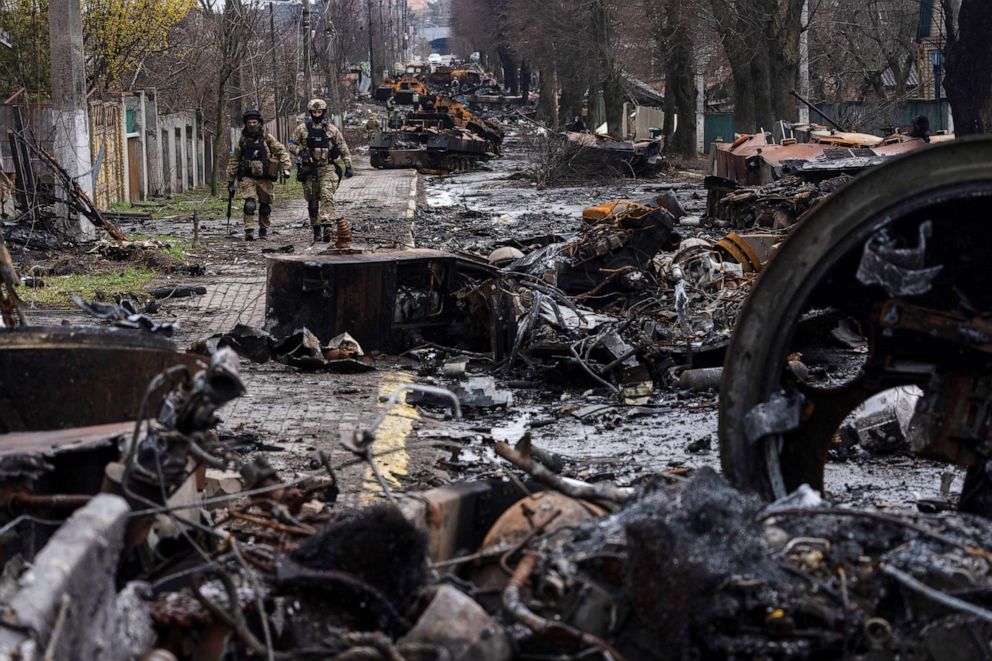 PHOTO: Soldiers walk amid destroyed Russian tanks in Bucha, on the outskirts of Kyiv, Ukraine, April 3, 2022.