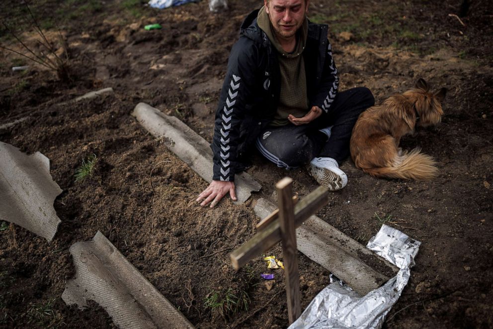 PHOTO: Serhii Lahovskyi, 26, mourns beside the grave of his friend Ihor Lytvynenko, who according to residents was killed by Russian soldiers, in Bucha, Ukraine, April 6, 2022.