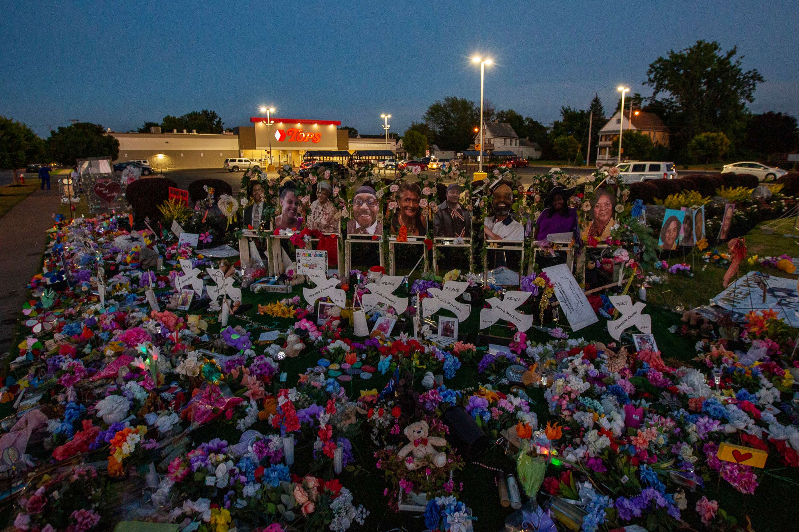 PHOTO: A memorial to the victims of a racially-motivated mass shooting at a Tops Friendly Markets in Buffalo, N.Y., remains on a lawn near the store, even as it is back open to customers, July 26, 2022.