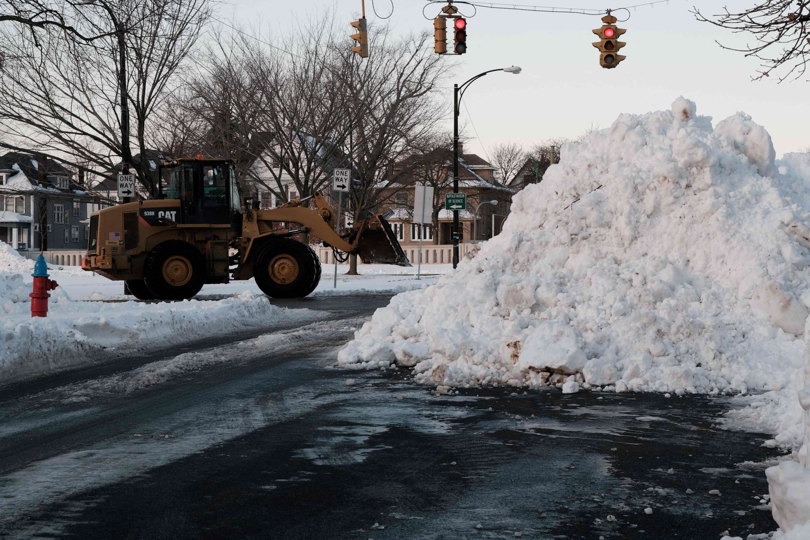 PHOTO: An excavator piles up snow on the east side of Buffalo, New York, Dec. 29, 2022.