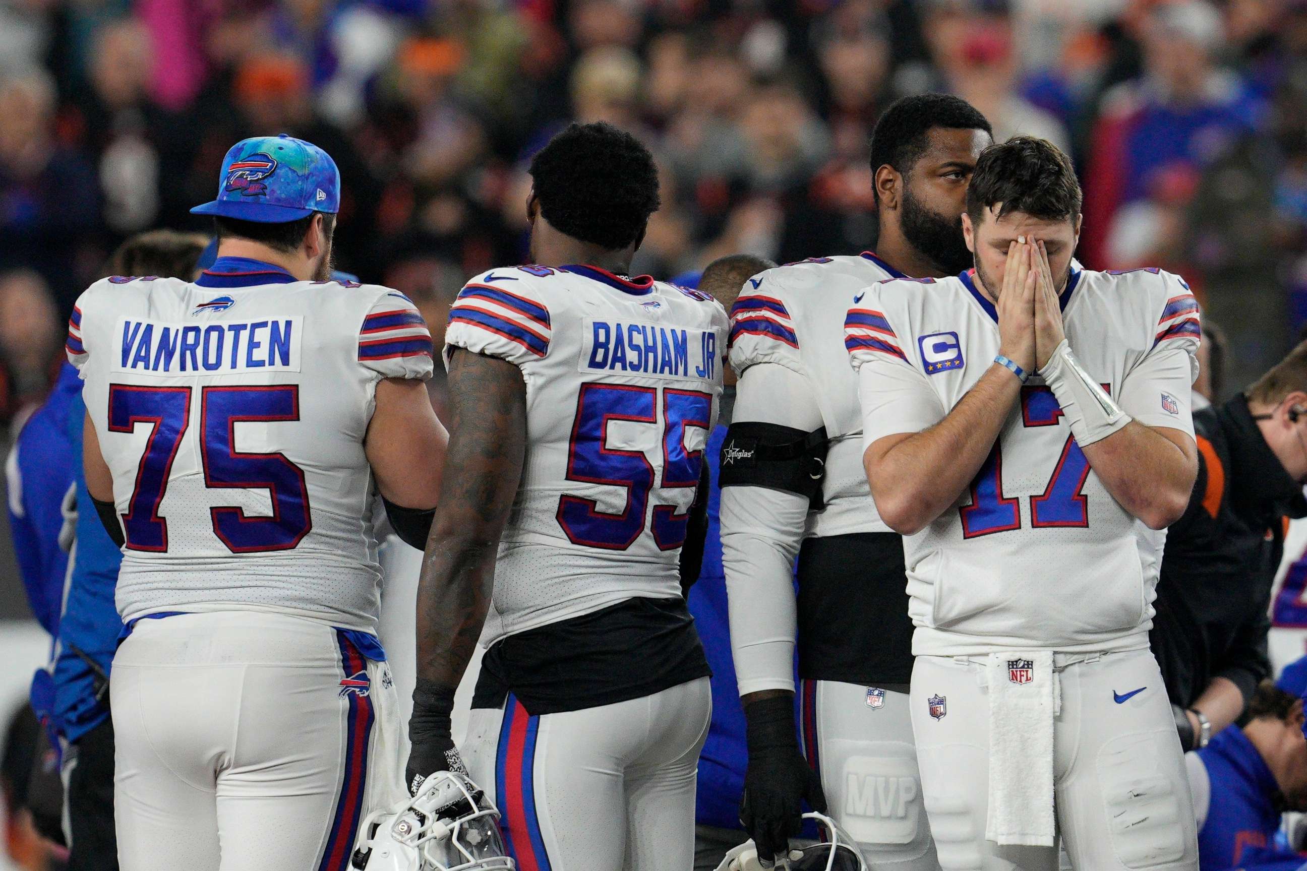 PHOTO: Buffalo Bills quarterback Josh Allen pauses as Damar Hamlin is examined after collapsing during the first half of an NFL football game against the Cincinnati Bengals, Jan. 2, 2023, in Cincinnati.