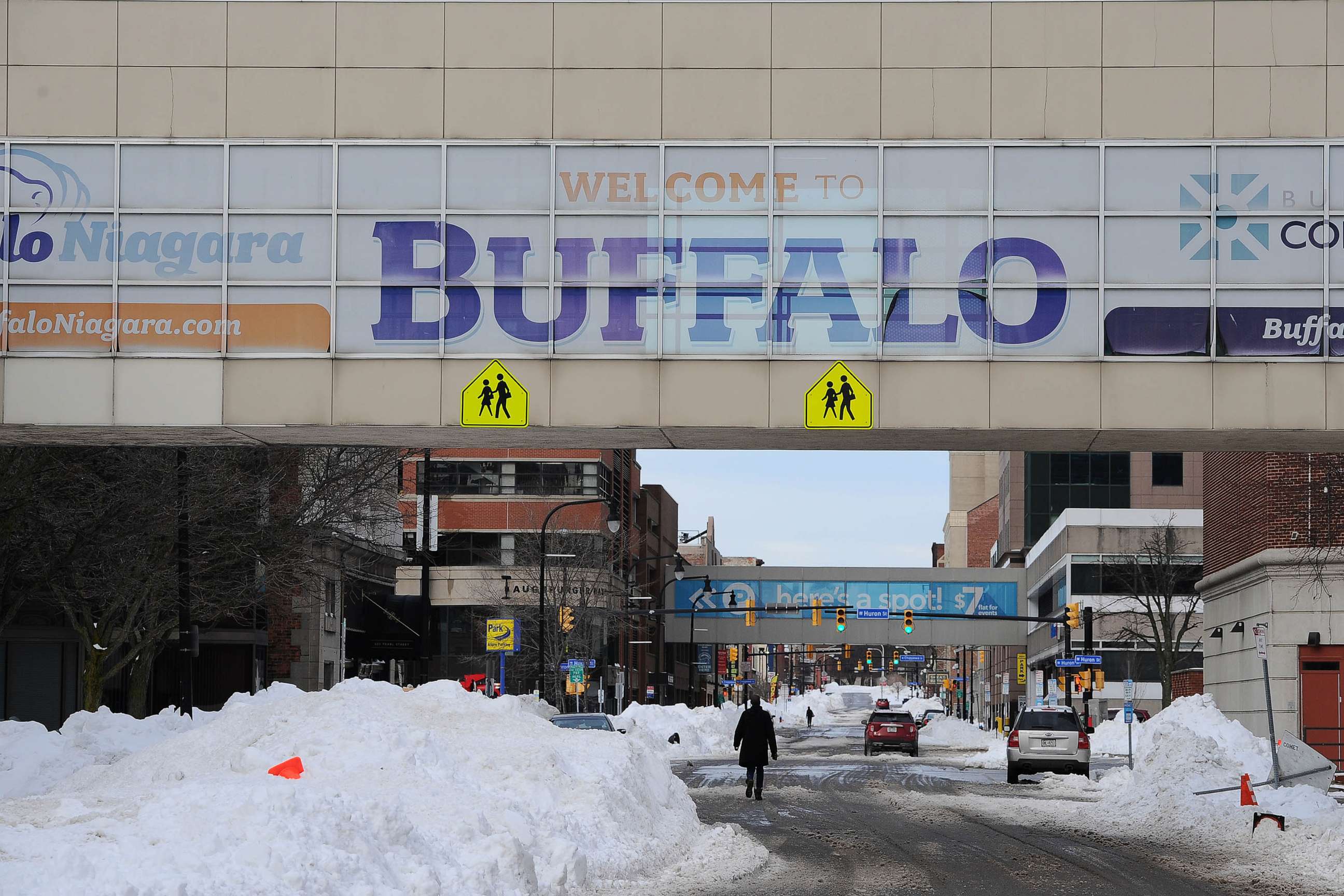 PHOTO: Pedestrians walk along Ellicott Street in downtown Buffalo, Dec. 28, 2022 in Buffalo, New York.