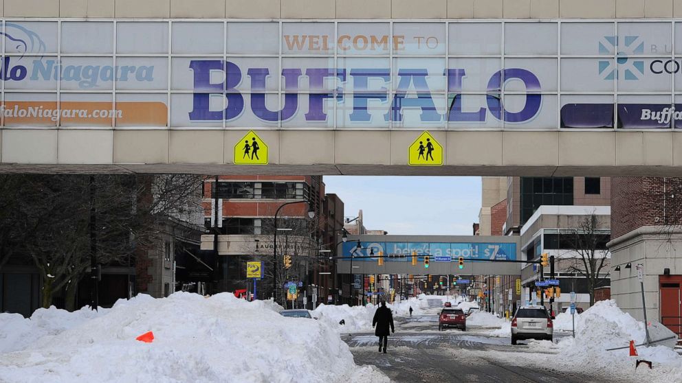 Photo: Pedestrians walk along Ellicott Street in downtown Buffalo, NY on December 28, 2022.