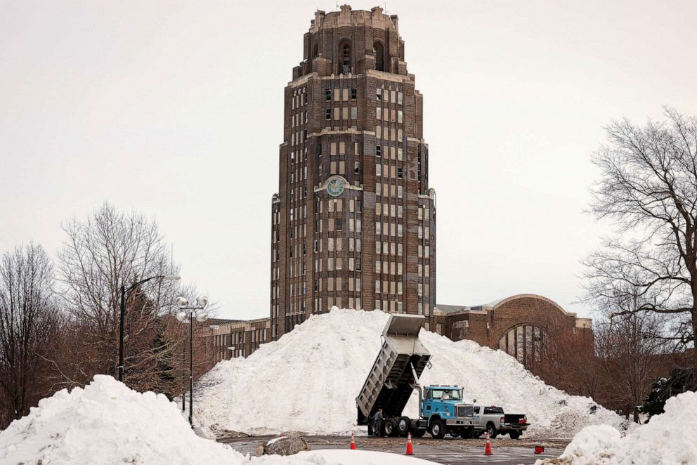 PHOTO: A dump truck drops off snow in front of Central Terminal following a winter storm in Buffalo, New York, Dec. 28, 2022.