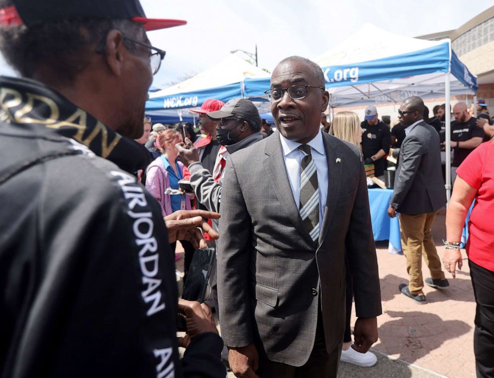 PHOTO: Mayor Byron Brown joins members of the Buffalo Bills in a visit to the Tops Supermarket site where 10 people were shot and killed in Buffalo, N.Y., May 18, 2022.