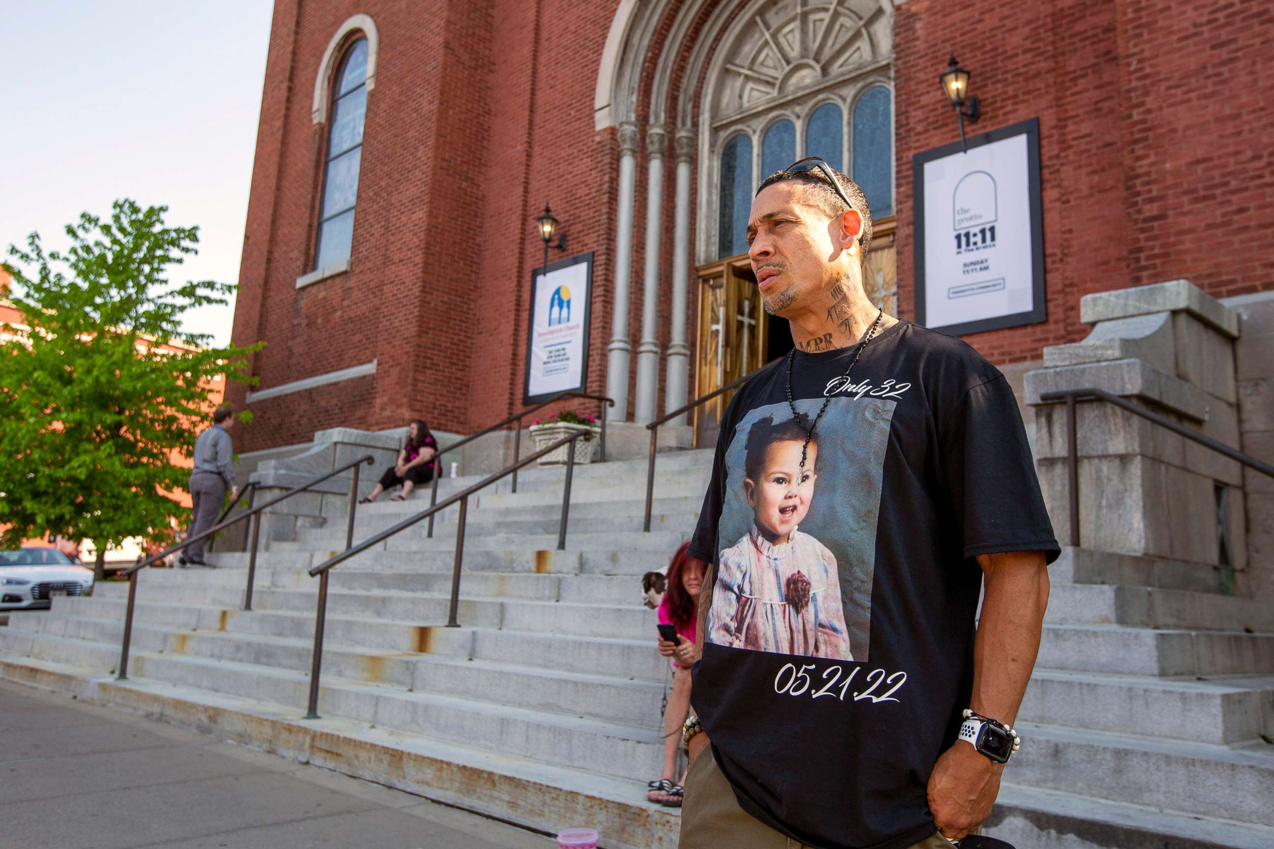 PHOTO: Enrique Owens, a cousin of Roberta Drury, wears a t-shirt with her photograph on it before her funeral service, May 21, 2022, in Syracuse, N.Y. Drury was one of 10 killed during a mass shooting at a supermarket last week in Buffalo.