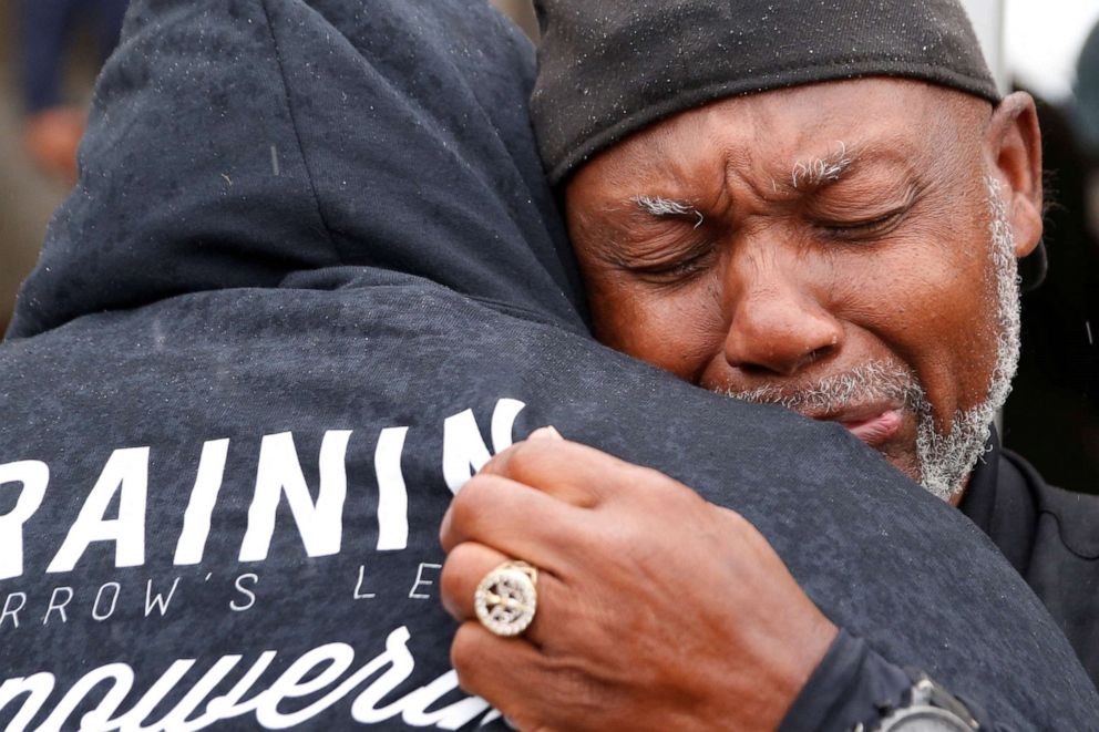 PHOTO: Mourners embrace two days after a shooting at TOPS supermarket in Buffalo, New York, May 16, 2022.