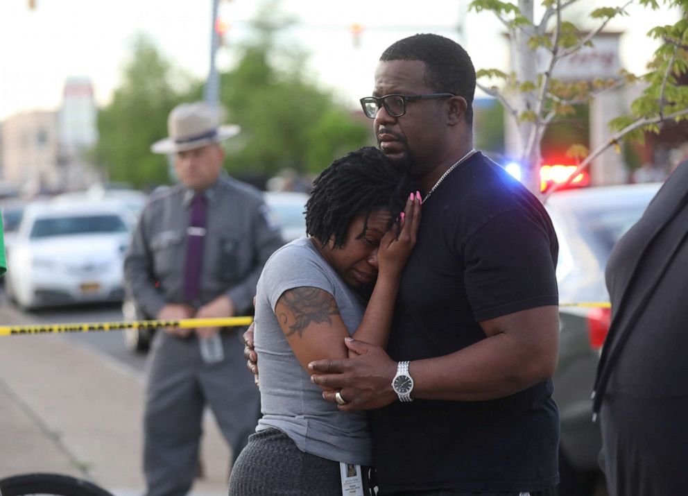 PHOTO: Bystanders react at the scene of a shooting at a Tops grocery store in Buffalo, NY, May 14, 2022.  