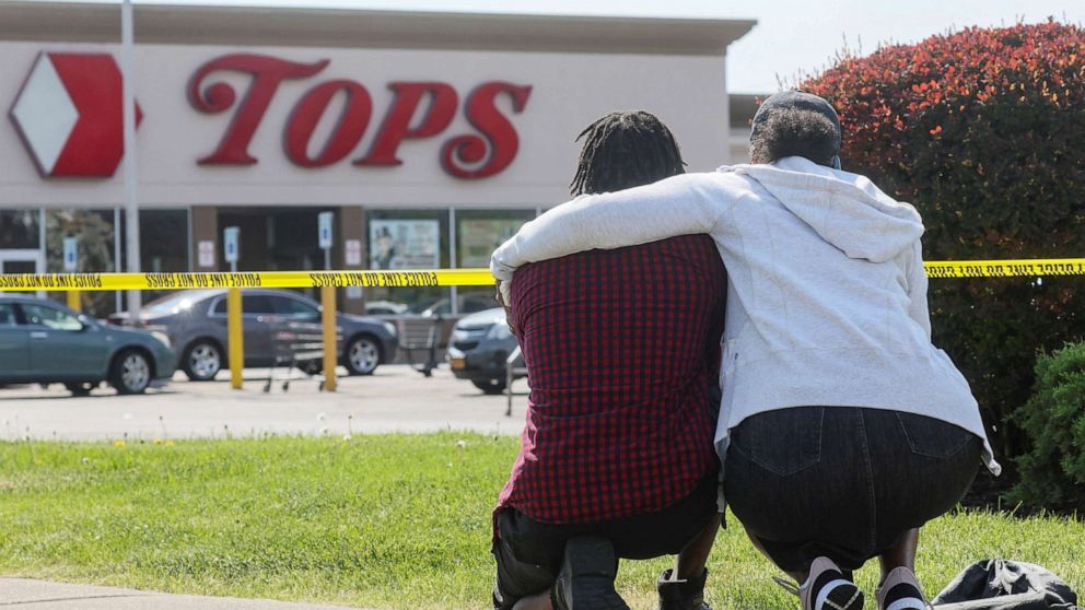 PHOTO: Mourners react while attending a vigil for victims of the shooting at a TOPS supermarket in Buffalo, NY, May 15, 2022.
