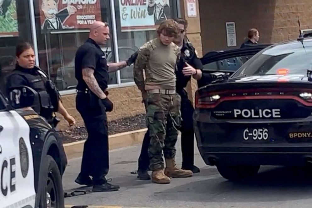 PHOTO: A man, identified as  Payton Gendron, is detained following a mass shooting in the parking lot of TOPS supermarket, in a still image from a social media video in Buffalo, NY, May 14, 2022. 