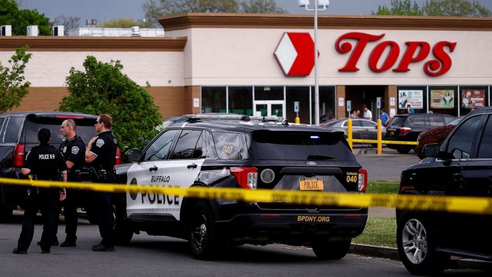 PHOTO: Police officers secure the scene after a shooting at TOPS supermarket in Buffalo, NY, May 14, 2022.  