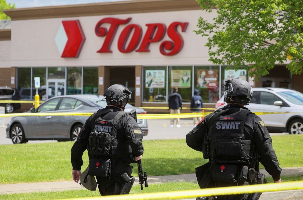 PHOTO: Members of the Buffalo Police department work at the scene of a shooting at a Tops supermarket in Buffalo, N.Y., May 17, 2022.