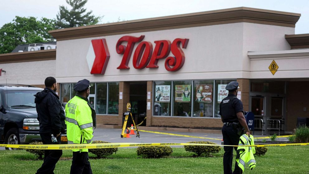 PHOTO: Members of the Buffalo Police department work at the scene of a shooting at a Tops supermarket in Buffalo, New York, May 16, 2022.