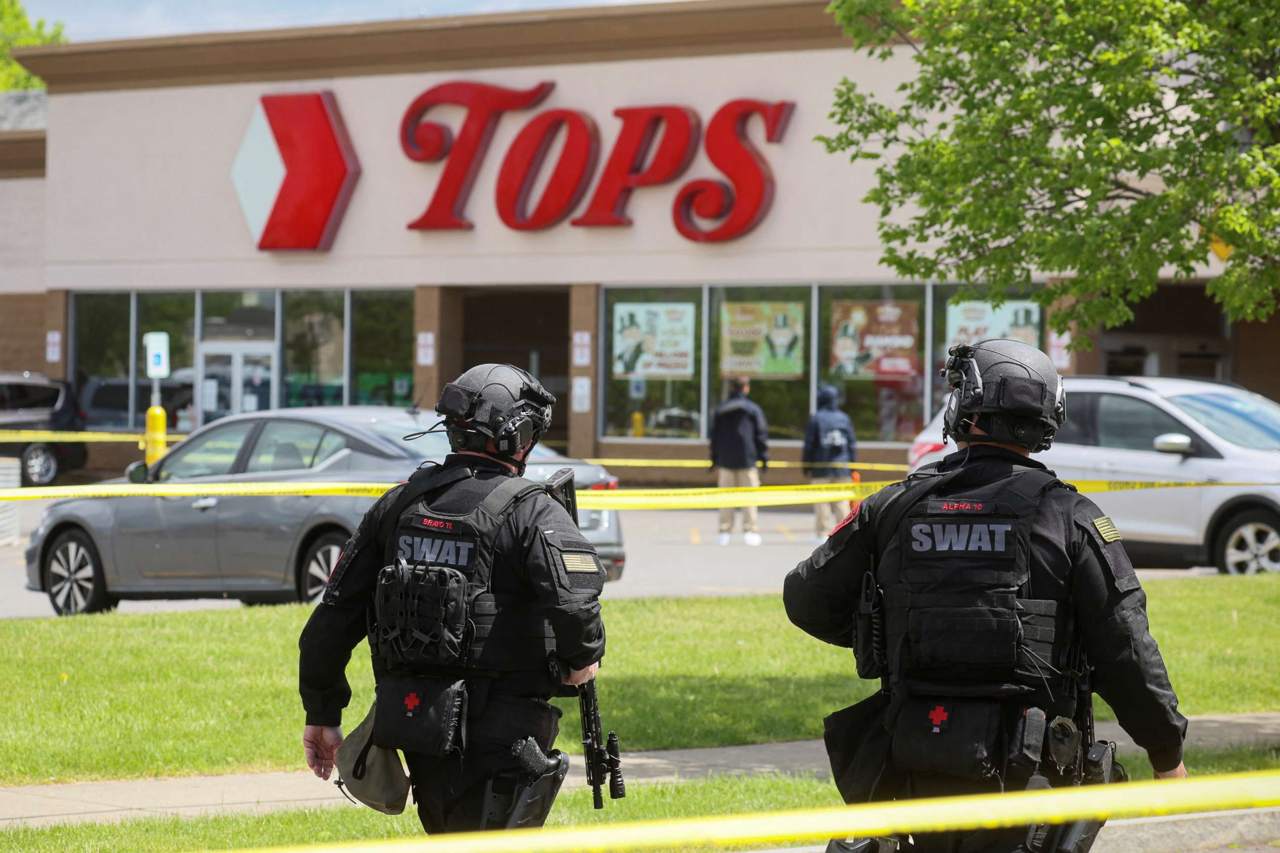 PHOTO: Members of the Buffalo Police Department work at the scene of a shooting at a Tops supermarket in Buffalo, N.Y., May 17, 2022.