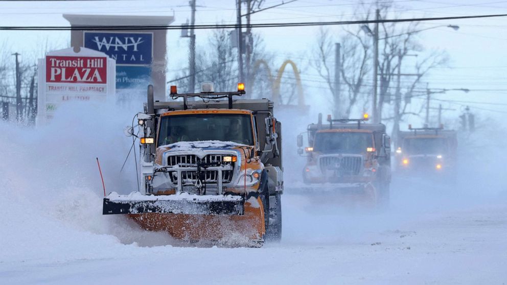 PHOTO: Snow plows clear the roads following a winter storm that hit the Buffalo region in Lancaster, New York, December 25, 2022.