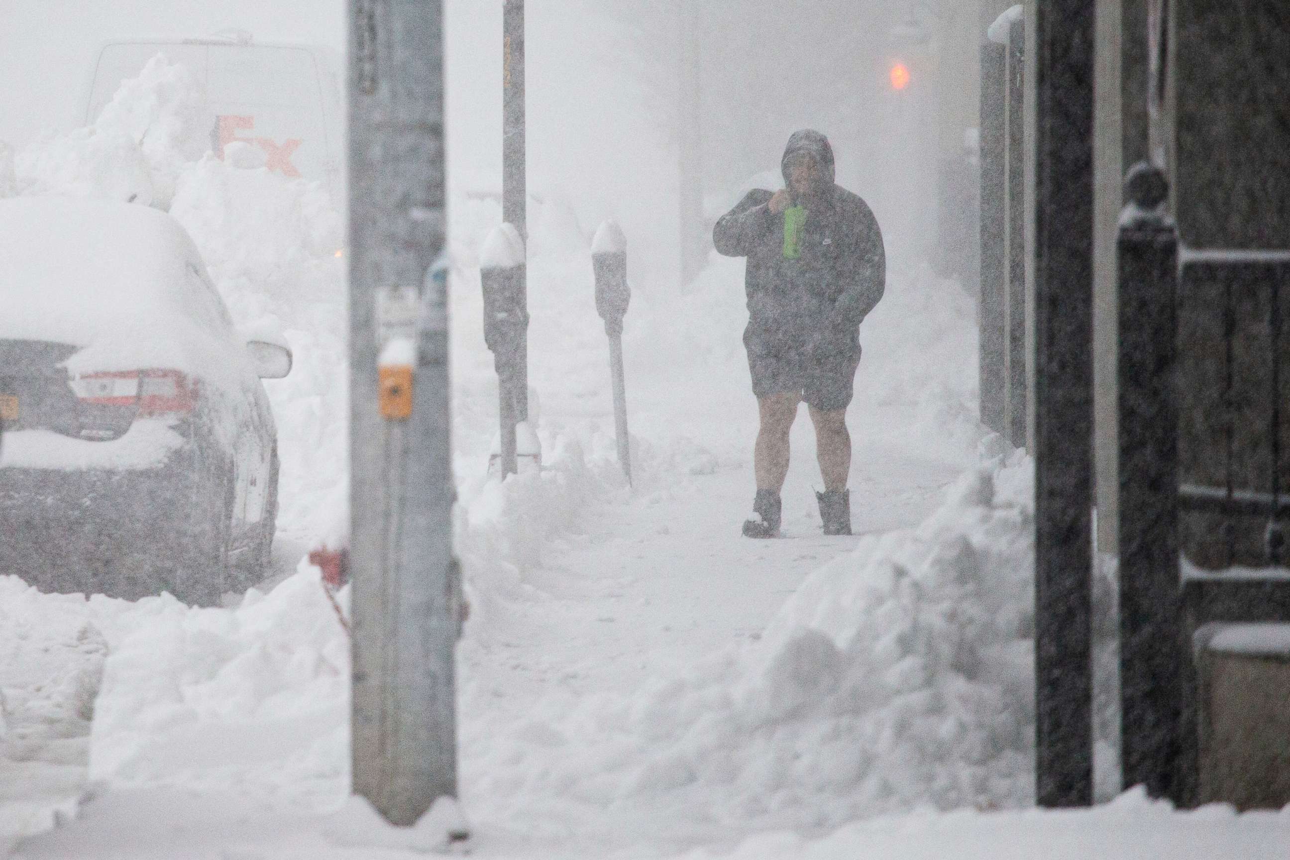 PHOTO: A person walks through downtown in the snow Friday, Nov. 18, 2022, in Buffalo, N.Y. A dangerous lake-effect snowstorm paralyzed parts of western and northern New York, with nearly 2 feet of snow already on the ground in some places.